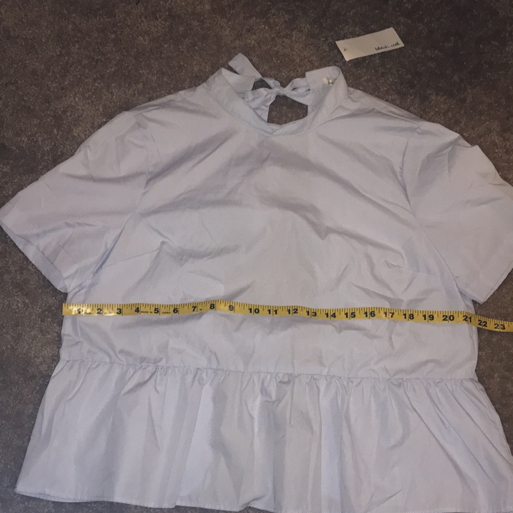 Peplum tie-back top.